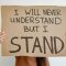 pexels photo 8377429 8377429 Close-up of hands holding a cardboard sign reading 'I Will Never Understand But I Stand'.